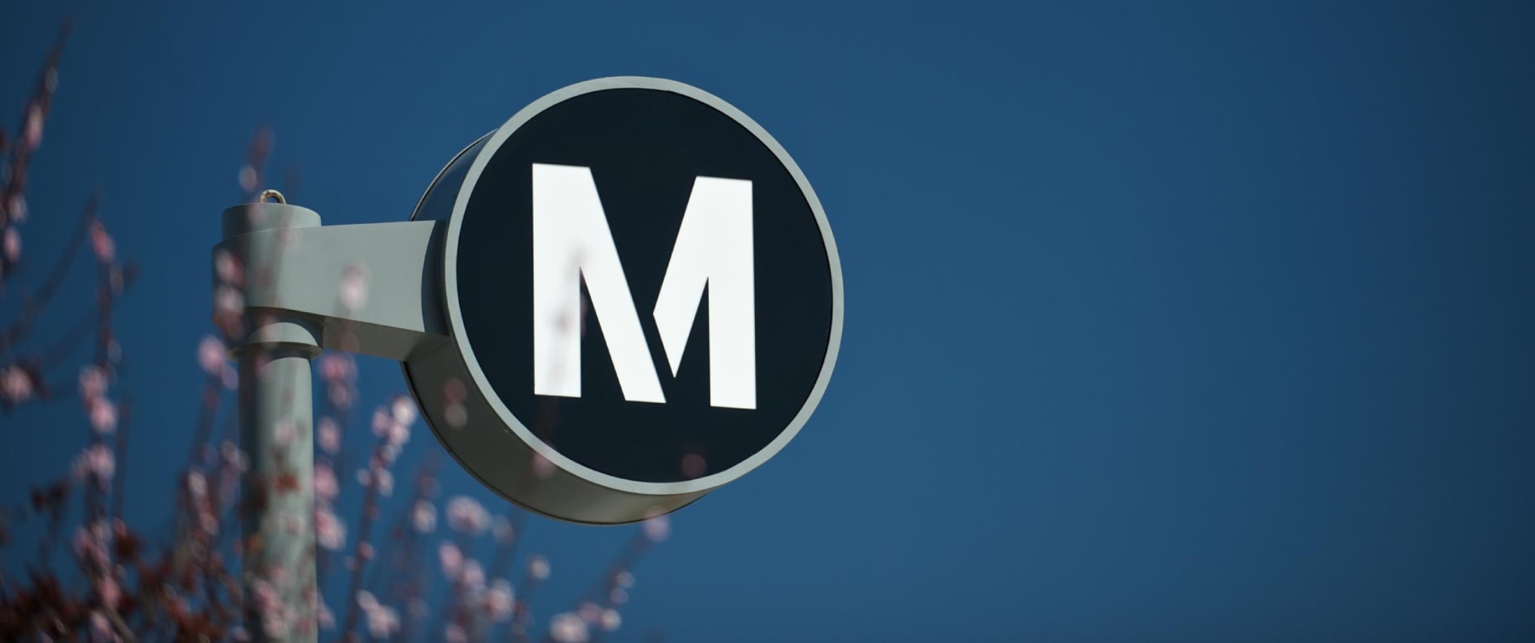 Metro station signage on post.