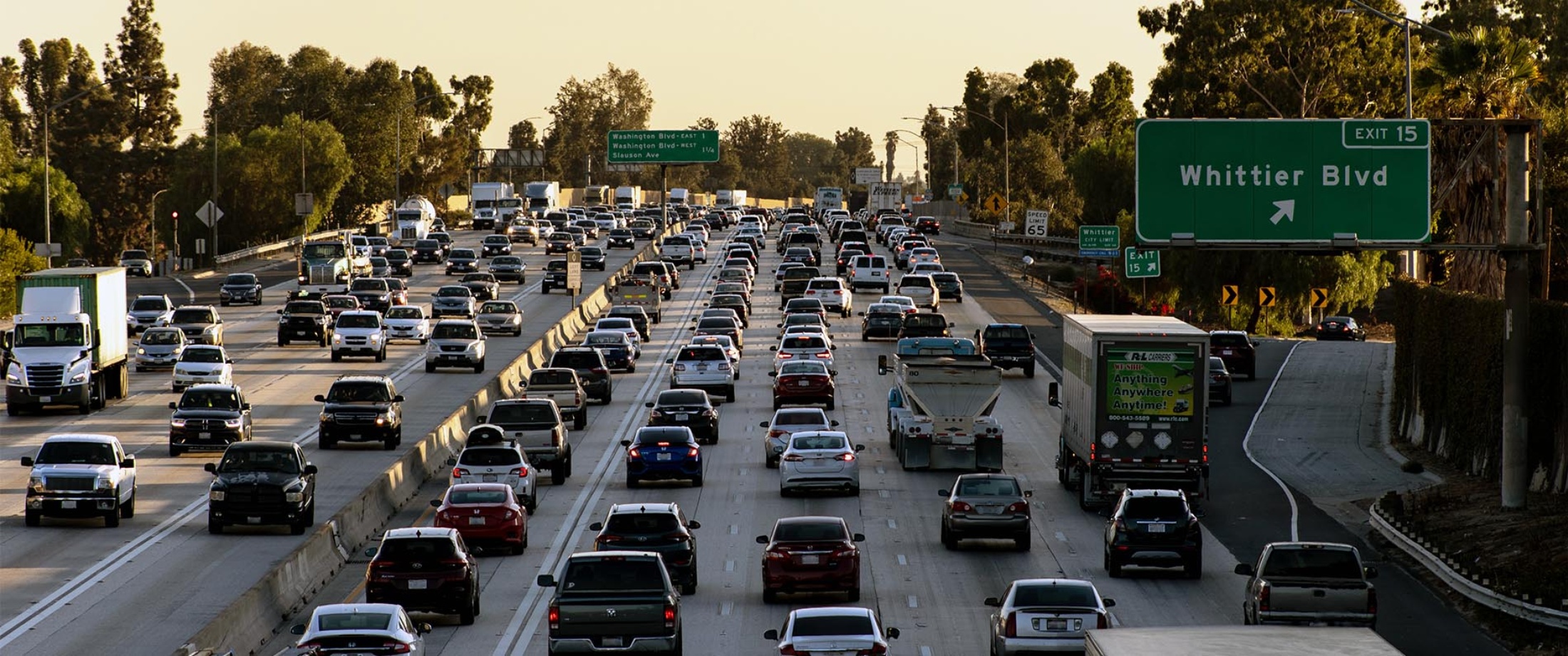 Vehicles on a crowded freeway (both directions).