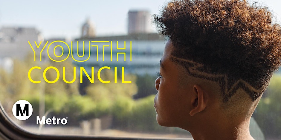 Young person looking out window of Metro Rail vehicle.